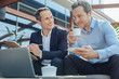© Viacheslav Yakobchuk - Delighted positive businessman sitting with his business partner