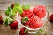 strawberry sorbet and sprigs of mint on wooden background