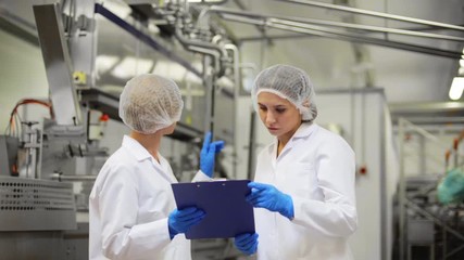 Wall Mural - women technologists at ice cream factory