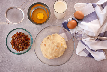 Sticker - Raw dough with raisins and ingredients on kitchen table