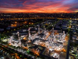 Wall Mural - Oil refinery plant at twilight with sky background.