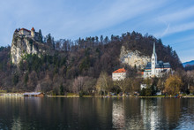 Bled, Slovenia, Europe. A Panoramic View Of The Castle Over The Lake.