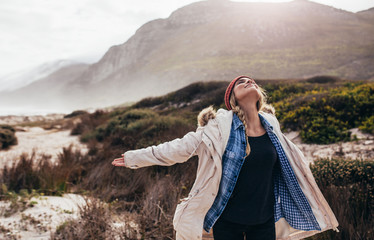 Wall Mural - Young female enjoying the winter view