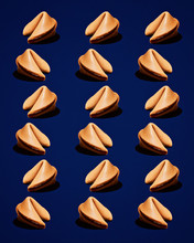 Fortune Cookies In Repeating Pattern On Dark Blue Background