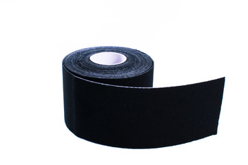 black kinesiology tape. Physiotherapy and therapeutic tape for wrist pain, aches and tension. elastic therapeutic tape. adhesive tape and alternative medicine.