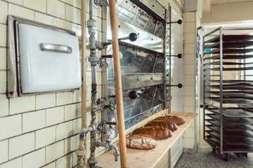 Wall Mural - Loafs of bread waiting on shelf in bakery to be sold in the shop