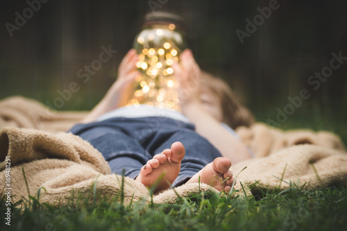 Fotografie, Obraz Childhood Outdoors: Fairy Lights in a Jar