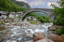 Silk Effect Waterfall And Old (stone, Romanesque) Bridge,Fondo, Valchiusella, Piedmont, Italy