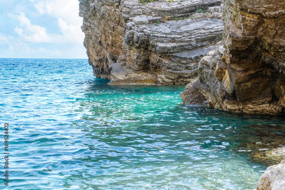 Beautiful view of blue sea with big cliff