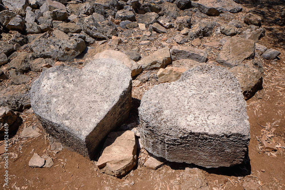 Stones in shape of hearts on ground