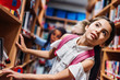 © LIGHTFIELD STUDIOS - schoolgirls looking for books in library