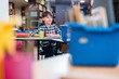 © LIGHTFIELD STUDIOS - schoolboy sitting in library