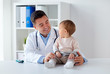 © Syda Productions - happy doctor or pediatrician with baby at clinic