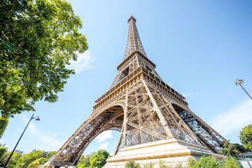 Landscape view from below on the Eiffel tower during the sunny weather in Paris