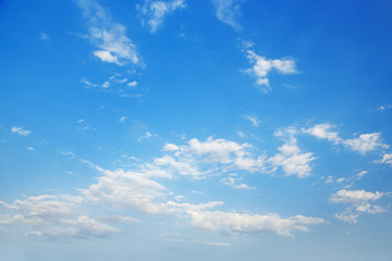 Poster - Cirrus clouds in bright blue sky.