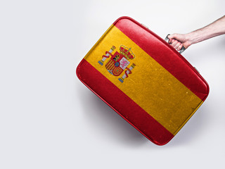 Wall Mural - Spain flag on a vintage leather suitcase.