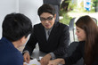 © Jestercine - Asian Business People  have Meeting for Business Project with Team, People Working Concept. Man Pointing on Paper Chart for Business Plan.