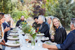 © Trinette Reed/Stocksy - Group of friends enjoying a Farm To Table Dinner Party