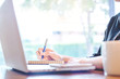 © apichon_tee - Business woman hand working with a laptop in the office.