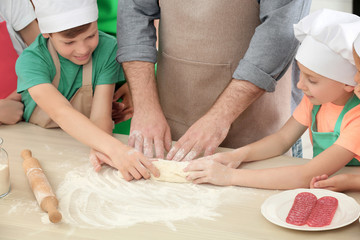 Poster - Group of children and teacher in kitchen during cooking classes