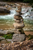 Fototapeta Desenie - Stones arranged zen-like by the river