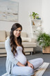 © LIGHTFIELD STUDIOS - Pregnant woman sitting in lotus pose