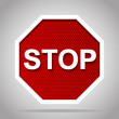 Stop road sign with white frame on red reflective background