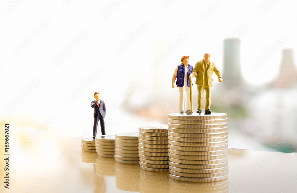 Concept of retirement planning. Miniature people: Old couple figure standing on top of coin stack. - obrazy, fototapety, plakaty 
