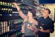 © JackF - Husband and wife selecting a beer at  store