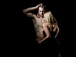 © Volodymyr - Boyfriend and girlfriend on black.