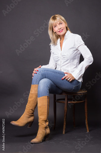 Beautiful Mature Woman 40s Sitting In Chair Studio Buy This