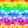 Geometric ornament of rainbow colors triangles on white background. Watercolor seamless pattern