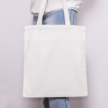 Girl In Blue Jeans Holds Blank Cotton Eco Tote Bag, Design Mockup. Handmade Shopping Bag For Girls