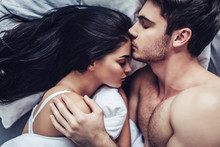 Young Love Couple In Bed