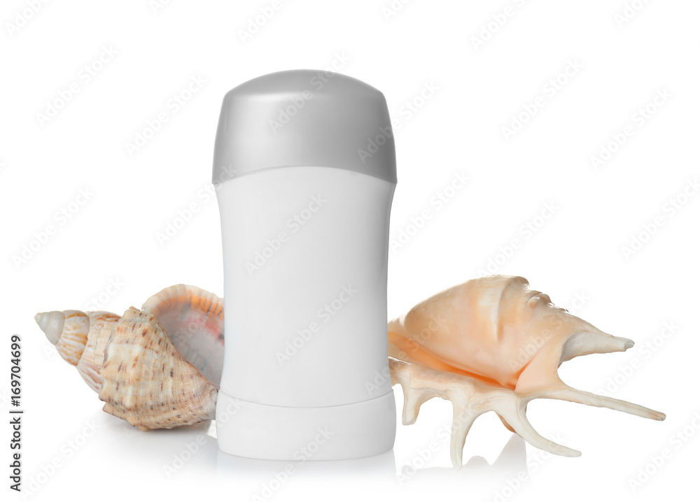 Female deodorant and sea shells on white background