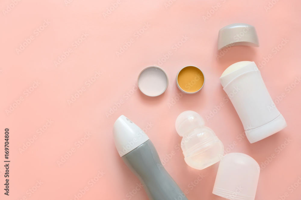 Female deodorants on color background