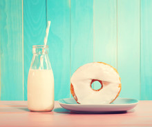 Donut With Milk On A Pastel Blue And Pink Background