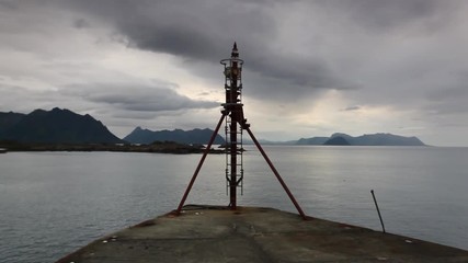 Wall Mural - Small lighthouse in Laukvik at sunset.Lofoten,Nordland,Norway