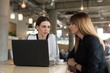 © Wavebreak Media - Female friends with laptop sitting in cafe