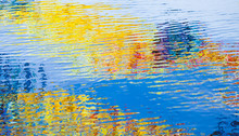 Water Surface With Colorful Reflections