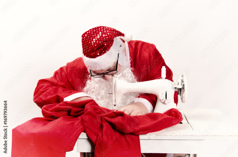 Santa Claus and sewing machine. Retro style. Christmas. Stock Photo ...