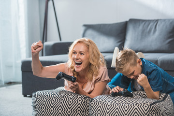 grandmother and grandson playing video game