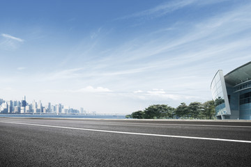 empty floor with cityscape of modern city in blue sky