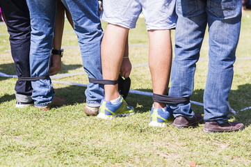 Five legged race outdoor party game, harmonious unity concept