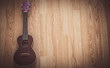 © Platoo Studio - Still Life Ukulele on Wooden Floor Background with Copy Space for Background