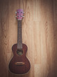 © Platoo Studio - Still Life Ukulele on Wooden Floor Background with Copy Space for Background
