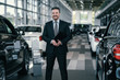© Nejron Photo - Top sales manager at dealership showroom