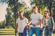 © Nejron Photo - Multi-ethnic group of friends in a park