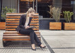 © xo4uphoto - Business woman working outdoors at her tablet