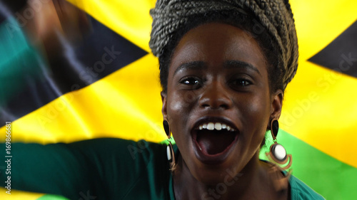 Jamaican Young Black Woman Celebrating with Jamaica Flag Poster Mural XXL